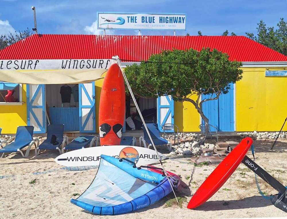 Instructor briefing a student on the beach
