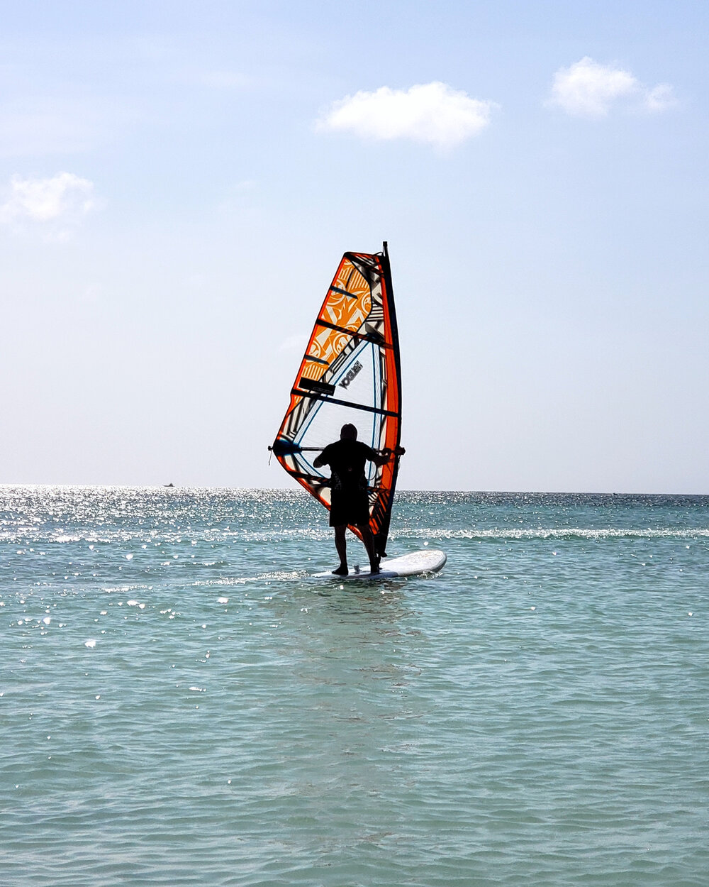 Windsurfer on flat water