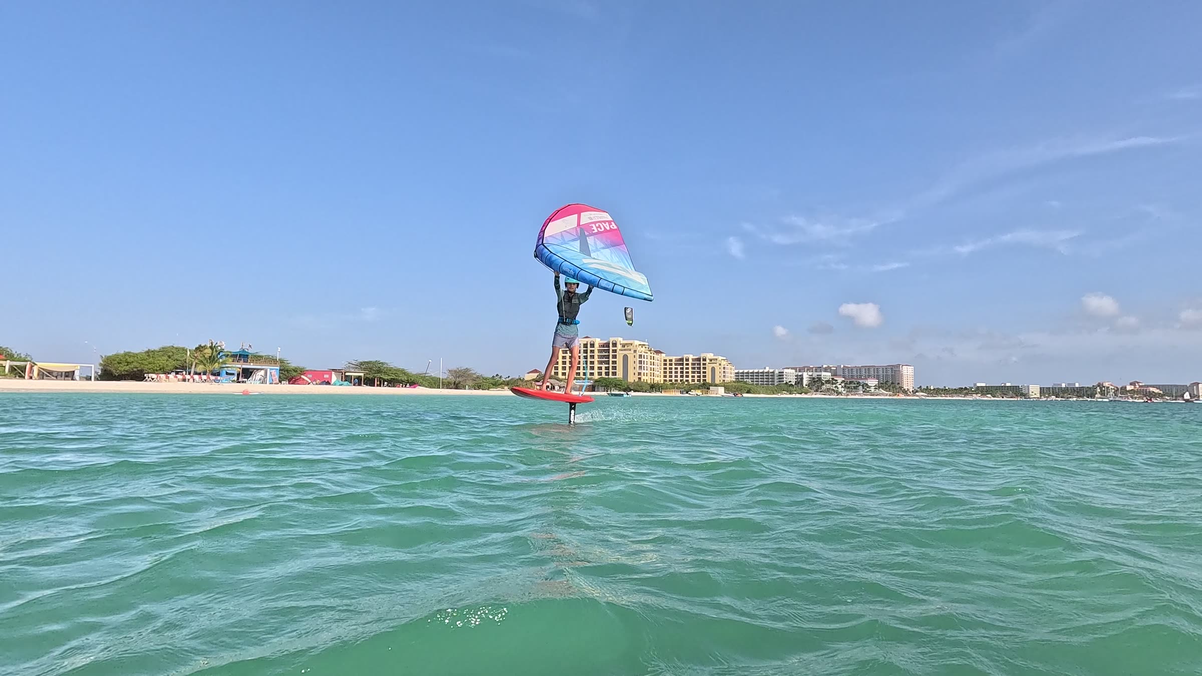 Wingfoiling along the beach